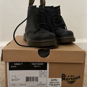 Black Doc Marten boots.